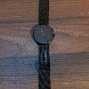 All black stainless steel watch.